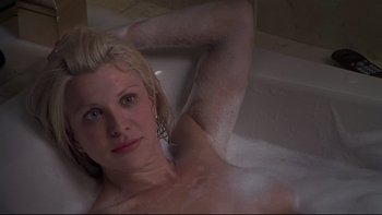 Movie still from “Trapped” (2002), directed by Luis Mandoki – A woman in a bath tub in a bathroom; Close Up shot, High angle