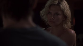 Movie still from “Trapped” (2002), directed by Luis Mandoki – A woman looking at a man in a mirror; Close Up shot, Over the shoulder angle