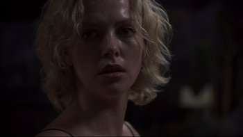 Movie still from “Trapped” (2002), directed by Luis Mandoki – A person with curly hair; Close Up shot, Low angle