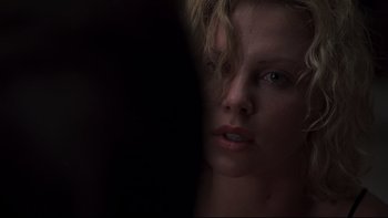 Movie still from “Trapped” (2002), directed by Luis Mandoki – A woman's face in the dark; Close Up shot, Over the shoulder angle