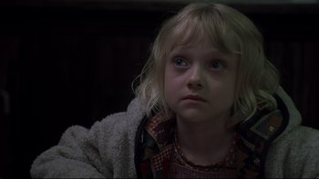 Movie still from “Trapped” (2002), directed by Luis Mandoki – A little girl sitting in front of the camera; Close Up shot, Over the shoulder angle
