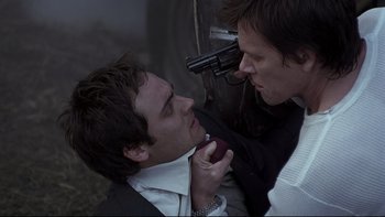 Movie still from “Trapped” (2002), directed by Luis Mandoki – Two men in suits and ties looking at each other; Close Up shot, Overhead angle