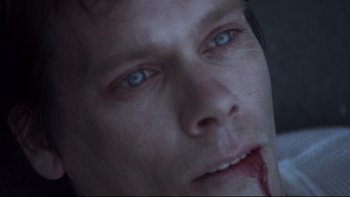 Movie still from “Trapped” (2002), directed by Luis Mandoki – A man's face with blue eyes; Extreme Close Up shot, Overhead angle