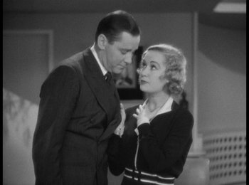 Movie still from “Trouble in Paradise” (1932), directed by Ernst Lubitsch – An older man and a younger woman standing next to each other; Medium shot, High angle