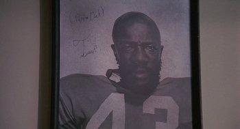 Movie still from “Truck Turner” (1974), directed by Jonathan Kaplan – A black and white photo of a football player; Extreme Close Up shot, High angle