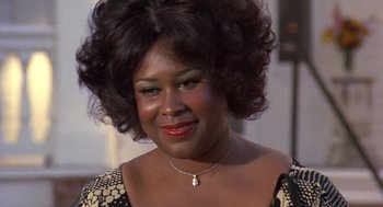 Movie still from “Truck Turner” (1974), directed by Jonathan Kaplan – A person wearing a necklace; Close Up shot, Low angle