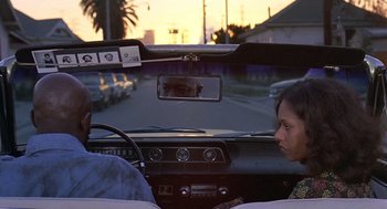 Movie still from “Truck Turner” (1974), directed by Jonathan Kaplan – Two people in the back seat of a car; Medium shot, Over the shoulder angle