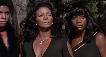 Movie still from “Truck Turner” (1974), directed by Jonathan Kaplan – Two black women with long black hair wearing black; Close Up shot, Low angle