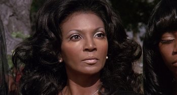 Movie still from “Truck Turner” (1974), directed by Jonathan Kaplan – A person with long hair; Close Up shot, Low angle