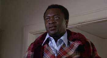 Movie still from “Truck Turner” (1974), directed by Jonathan Kaplan – A person wearing a jacket; Close Up shot, Low angle