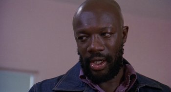 Movie still from “Truck Turner” (1974), directed by Jonathan Kaplan – A person with a beard; Close Up shot, Low angle