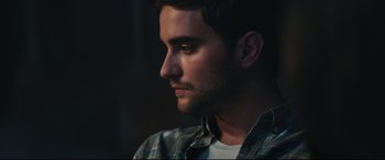 Movie still from “Truth or Dare” (2018), directed by Jeff Wadlow – A person looking to his left; Close Up shot, Over the shoulder angle