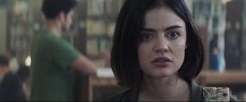 Movie still from “Truth or Dare” (2018), directed by Jeff Wadlow – A person with short black hair; Close Up shot, Over the shoulder angle