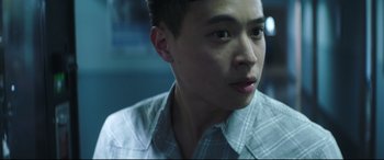 Movie still from “Truth or Dare” (2018), directed by Jeff Wadlow – A young man is looking into the distance; Close Up shot, Over the shoulder angle