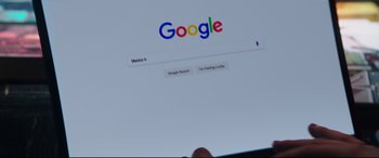 Movie still from “Truth or Dare” (2018), directed by Jeff Wadlow – The google logo on a computer screen; Extreme Close Up shot, Low angle