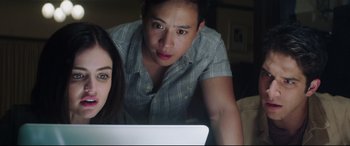 Movie still from “Truth or Dare” (2018), directed by Jeff Wadlow – A man and a woman looking at a computer screen; Close Up shot, Over the shoulder angle
