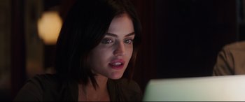Movie still from “Truth or Dare” (2018), directed by Jeff Wadlow – A beautiful young woman looking at a laptop computer; Close Up shot, Over the shoulder angle