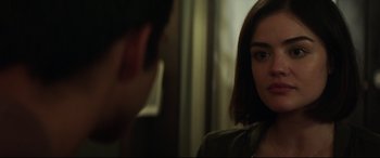 Movie still from “Truth or Dare” (2018), directed by Jeff Wadlow – A woman looking at a man in a mirror; Close Up shot, Over the shoulder angle