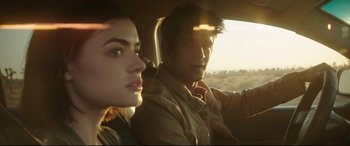 Movie still from “Truth or Dare” (2018), directed by Jeff Wadlow – A man and a woman sitting in a car looking out the window; Close Up shot, Over the shoulder angle
