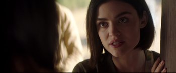 Movie still from “Truth or Dare” (2018), directed by Jeff Wadlow – A woman's face in a room; Close Up shot, Over the shoulder angle