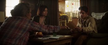 Movie still from “Truth or Dare” (2018), directed by Jeff Wadlow – A woman sitting at a table in front of a man; Medium shot, Over the shoulder angle