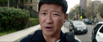 Movie still from “Truth or Dare” (2018), directed by Jeff Wadlow – A person wearing a police uniform; Close Up shot, Low angle