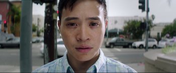 Movie still from “Truth or Dare” (2018), directed by Jeff Wadlow – A man's face on the side of the street; Close Up shot, Low angle