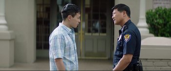 Movie still from “Truth or Dare” (2018), directed by Jeff Wadlow – Two men are standing next to each other talking; Medium shot, Over the shoulder angle