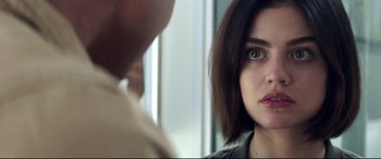 Movie still from “Truth or Dare” (2018), directed by Jeff Wadlow – A person with short black hair; Close Up shot, Over the shoulder angle