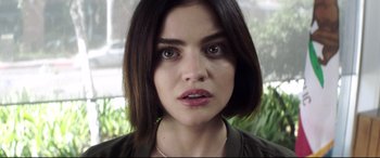 Movie still from “Truth or Dare” (2018), directed by Jeff Wadlow – A person with short black hair; Close Up shot, High angle