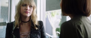Movie still from “Truth or Dare” (2018), directed by Jeff Wadlow – A woman wearing a leather jacket is talking to another woman; Close Up shot, Over the shoulder angle