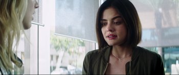 Movie still from “Truth or Dare” (2018), directed by Jeff Wadlow – A person wearing a green shirt; Close Up shot, Over the shoulder angle