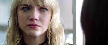 Movie still from “Truth or Dare” (2018), directed by Jeff Wadlow – A woman with blonde hair and green eyes; Close Up shot, Over the shoulder angle