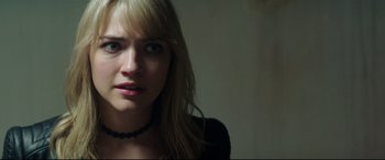 Movie still from “Truth or Dare” (2018), directed by Jeff Wadlow – A person wearing a necklace; Close Up shot, Over the shoulder angle