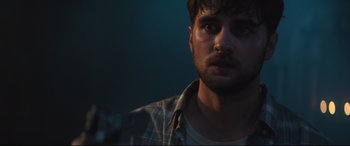 Movie still from “Truth or Dare” (2018), directed by Jeff Wadlow – A person wearing a plaid shirt; Close Up shot, Over the shoulder angle