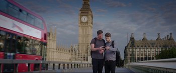 Movie still from “Truth or Dare” (2018), directed by Jeff Wadlow – Two young men standing next to each other in front of big ben in london; Wide shot, Low angle
