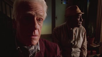 Movie still from “Twilight Zone: The Movie” (1983), directed by Steven Spielberg – Two older men sitting next to each other in a room; Close Up shot, Low angle