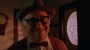 Movie still from “Twilight Zone: The Movie” (1983), directed by Steven Spielberg – An older man wearing glasses and a bow tie; Close Up shot, Low angle