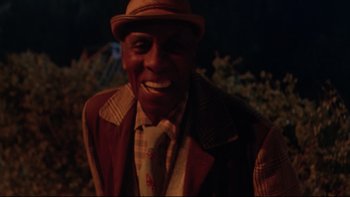 Movie still from “Twilight Zone: The Movie” (1983), directed by Steven Spielberg – An older man wearing a hat and a jacket; Close Up shot, Low angle