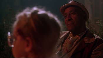 Movie still from “Twilight Zone: The Movie” (1983), directed by Steven Spielberg – An older man and a young girl are looking at each other; Close Up shot, Over the shoulder angle