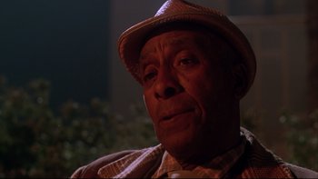 Movie still from “Twilight Zone: The Movie” (1983), directed by Steven Spielberg – An older man wearing a hat and looking at the camera; Close Up shot, Low angle