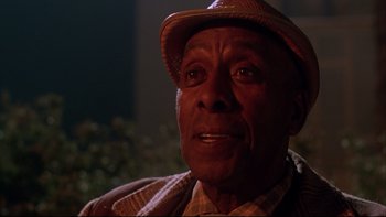 Movie still from “Twilight Zone: The Movie” (1983), directed by Steven Spielberg – An older man wearing a hat and a plaid shirt; Close Up shot, Low angle