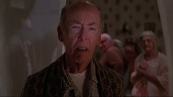 Movie still from “Twilight Zone: The Movie” (1983), directed by Steven Spielberg – An older man with a frown on his face; Close Up shot, Over the shoulder angle