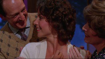 Movie still from “Twilight Zone: The Movie” (1983), directed by Steven Spielberg – A person with curly brown hair; Close Up shot, Over the shoulder angle