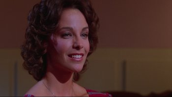 Movie still from “Twilight Zone: The Movie” (1983), directed by Steven Spielberg – A person wearing a necklace; Close Up shot, Low angle