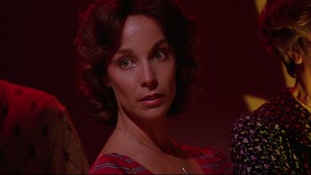 Movie still from “Twilight Zone: The Movie” (1983), directed by Steven Spielberg – A person wearing a red shirt; Close Up shot, Over the shoulder angle