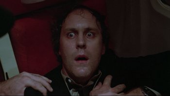 Movie still from “Twilight Zone: The Movie” (1983), directed by Steven Spielberg – A person with his mouth wide open; Close Up shot, Low angle