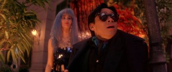 Movie still from “Twin Dragons” (1992), directed by Ringo Lam – A man and a woman are standing in a dark room; Close Up shot, Low angle