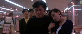 Movie still from “Twin Dragons” (1992), directed by Ringo Lam – A group of people standing in a room; Medium shot, Low angle