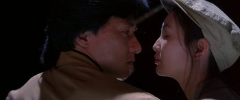 Movie still from “Twin Dragons” (1992), directed by Ringo Lam – A man and a woman face to face in the dark; Close Up shot, Low angle